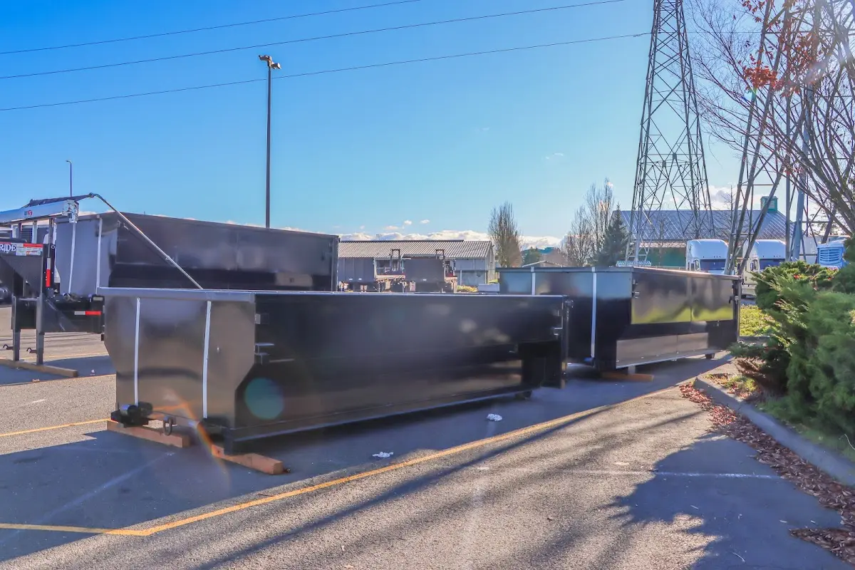 Roll-off dumpster ready for waste disposal at job site for Demolition Dumpster Rental in Shallotte
